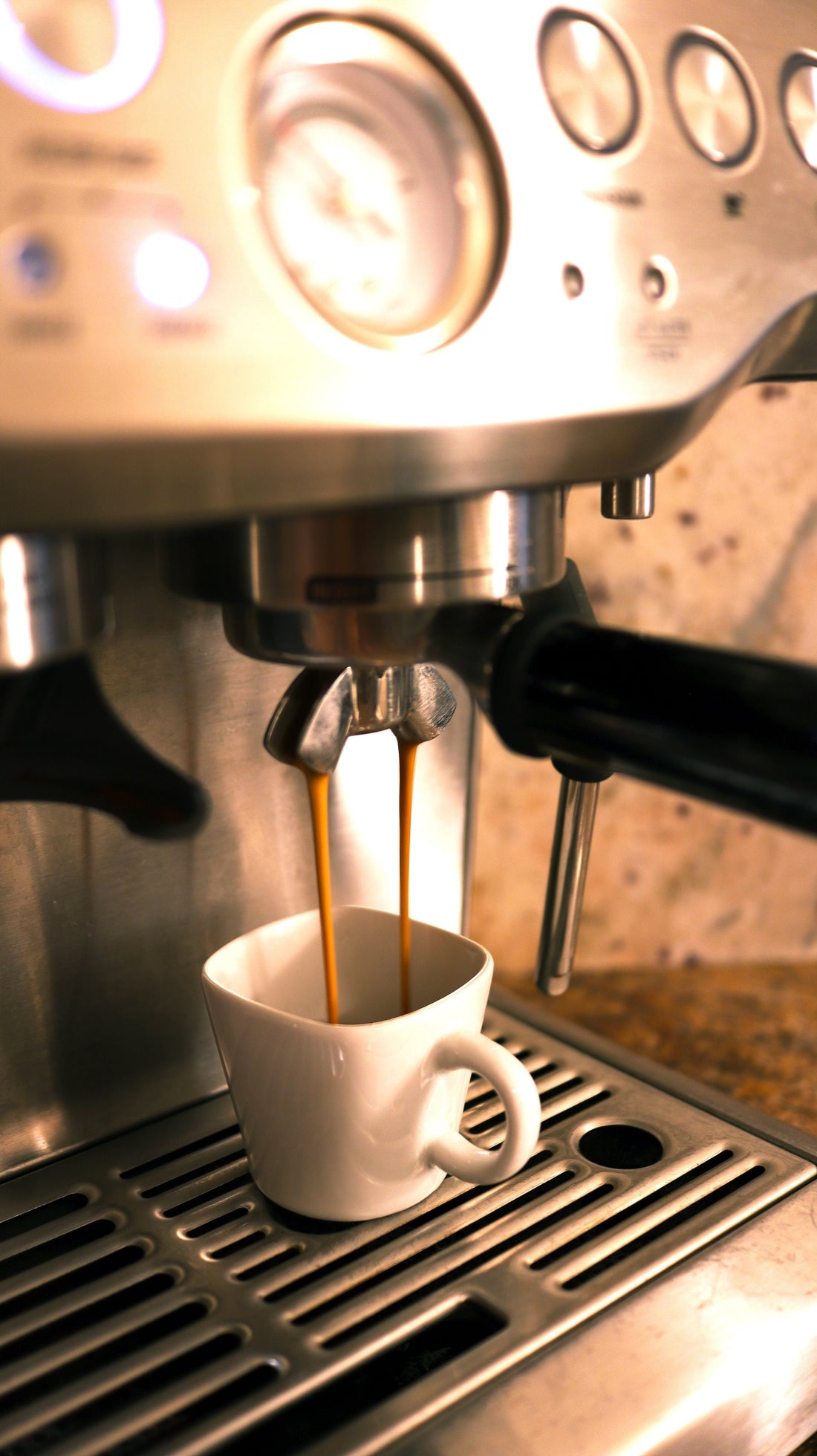 An espresso machine pulling a shot at a newly opened coffee shop
